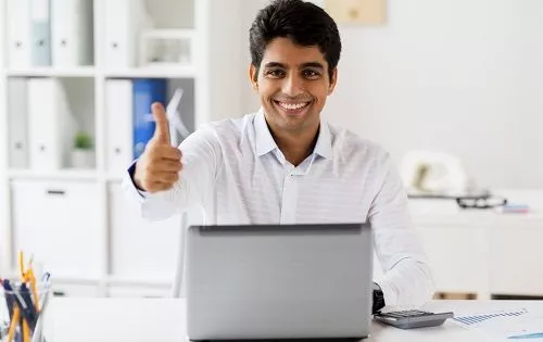 Dentist Looking At Accounting Screen